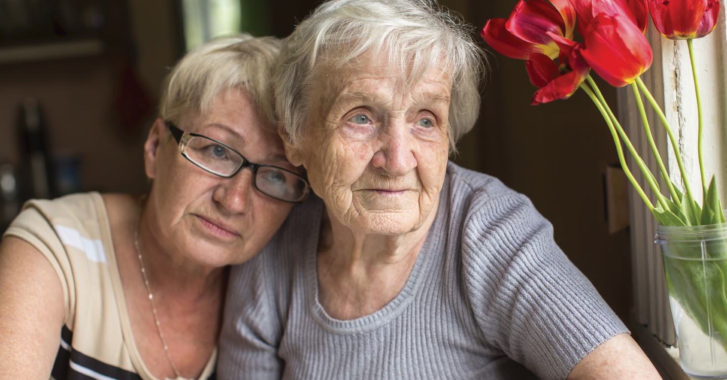 a daughter being a caregiver for her elderly mother