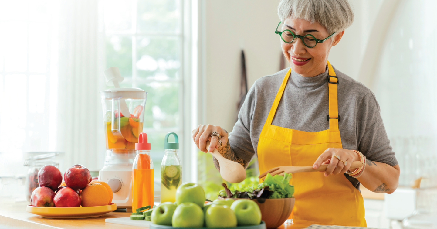 woman making healthy food to help prevent breast cancer