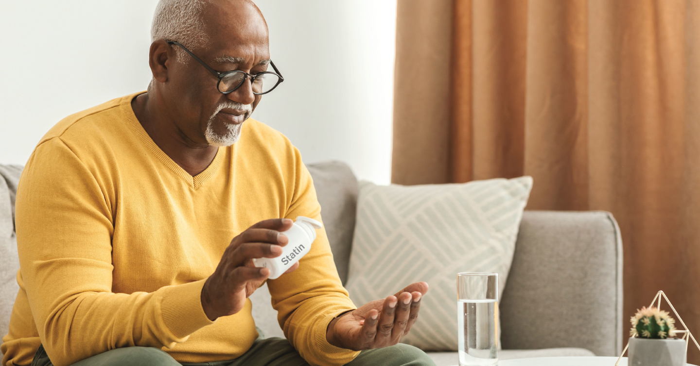 man taking statins medication