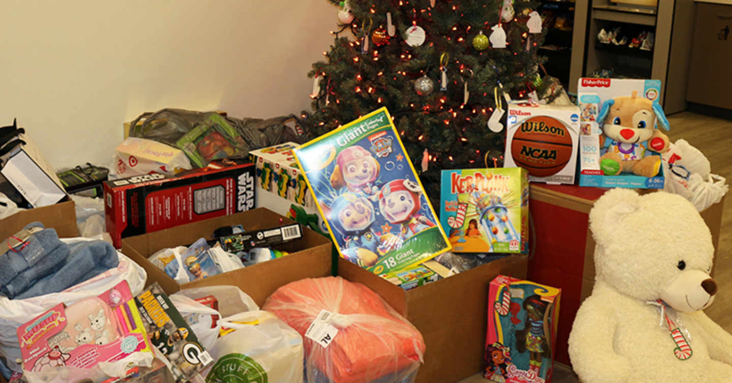 holiday presents laid out for Network Health adopt a family program