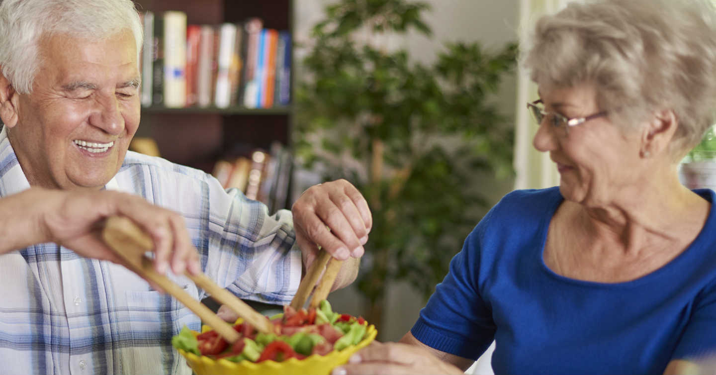 older couple eating salad