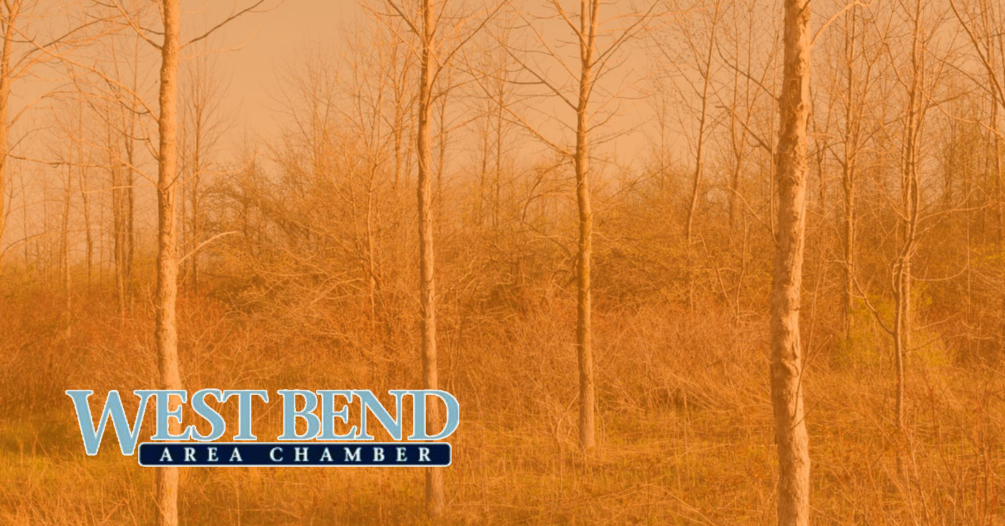 overlaid image of woods in west bend with west bend chamber logo