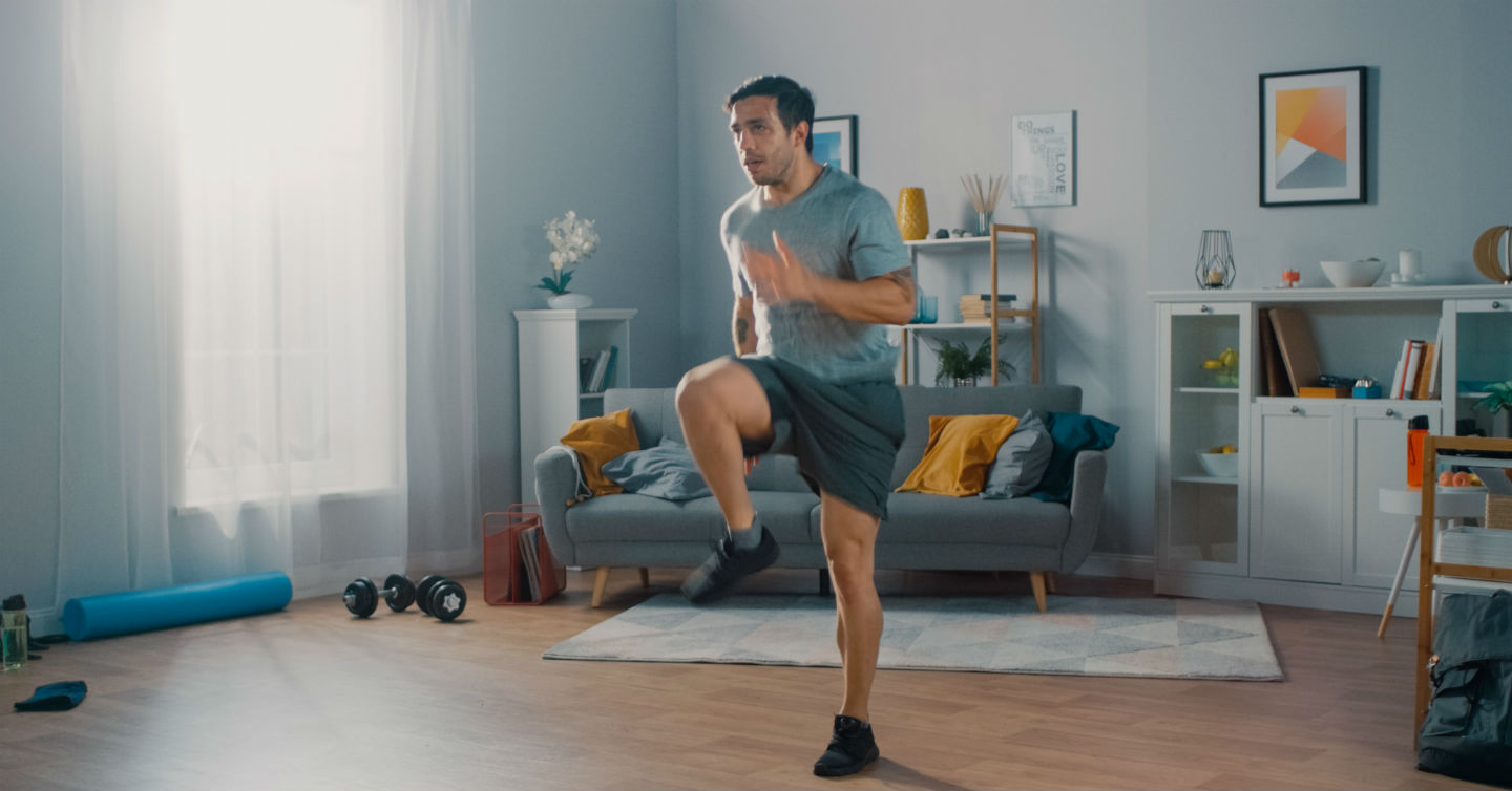 man exercising in his living room