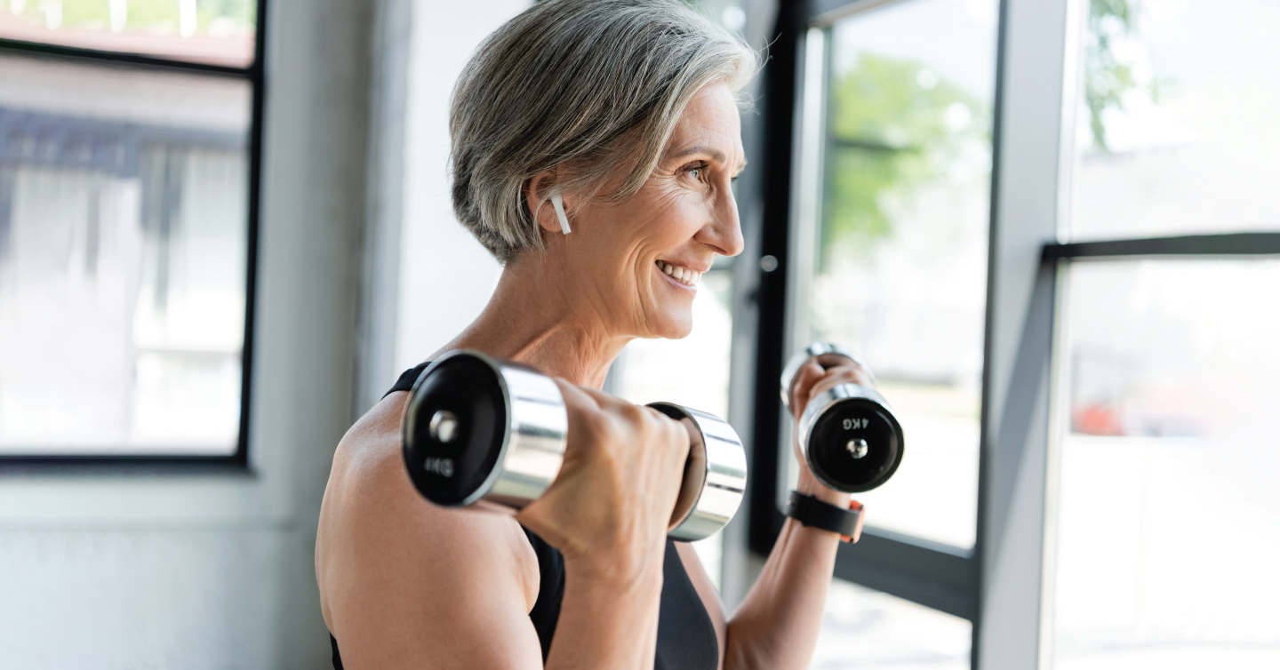 an senior person with osteoporosis lifting weights for exercise