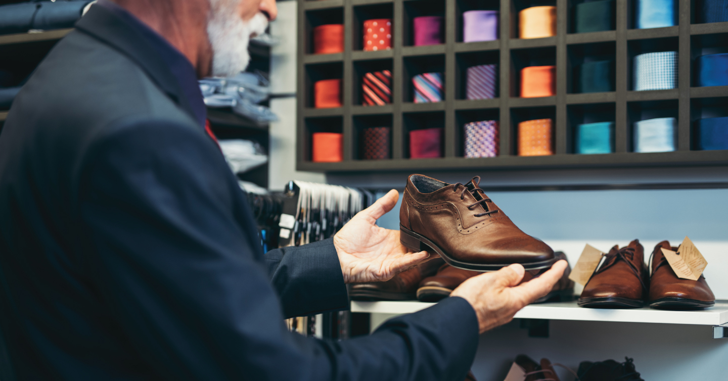 senior person looking at new shoes