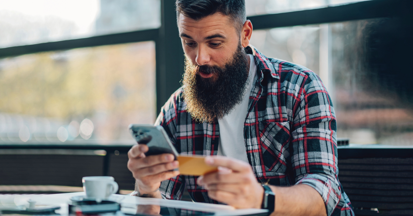 man giving someone credit card info over the phone