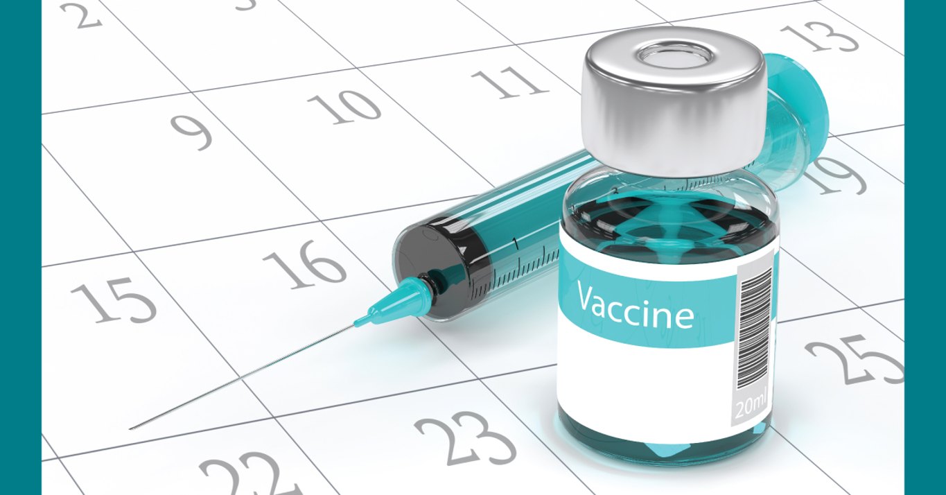 vaccine vial with syringe on calendar