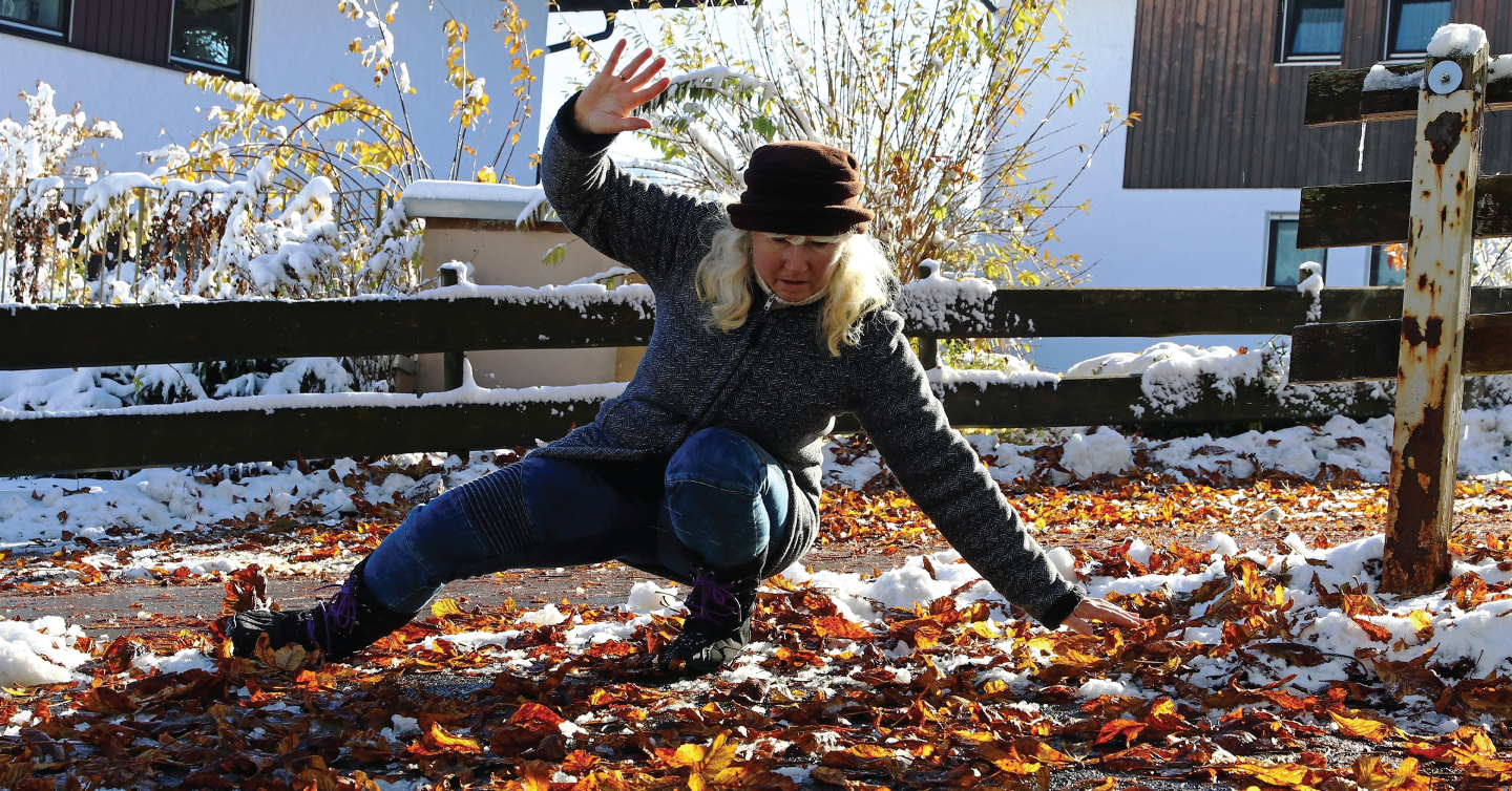 person slipping on wet leaves