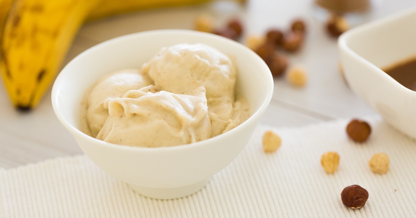bowl of banana-based ice cream with banana in background
