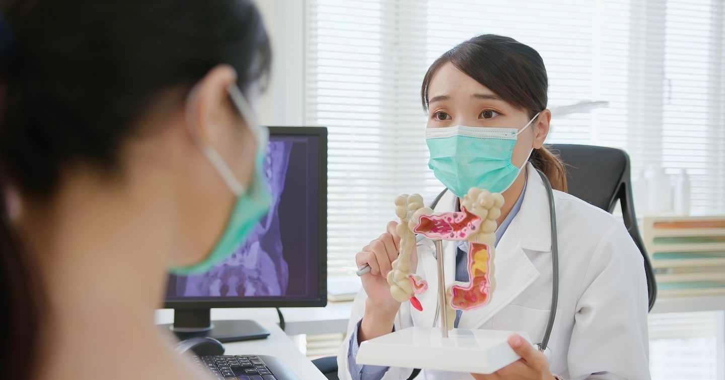 person consulting doctor for colorectal screening