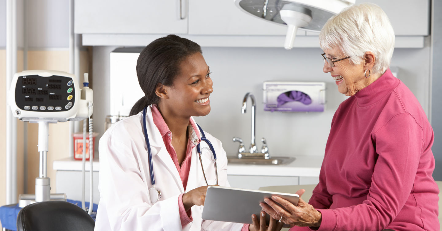 woman at doctors office for breast health check