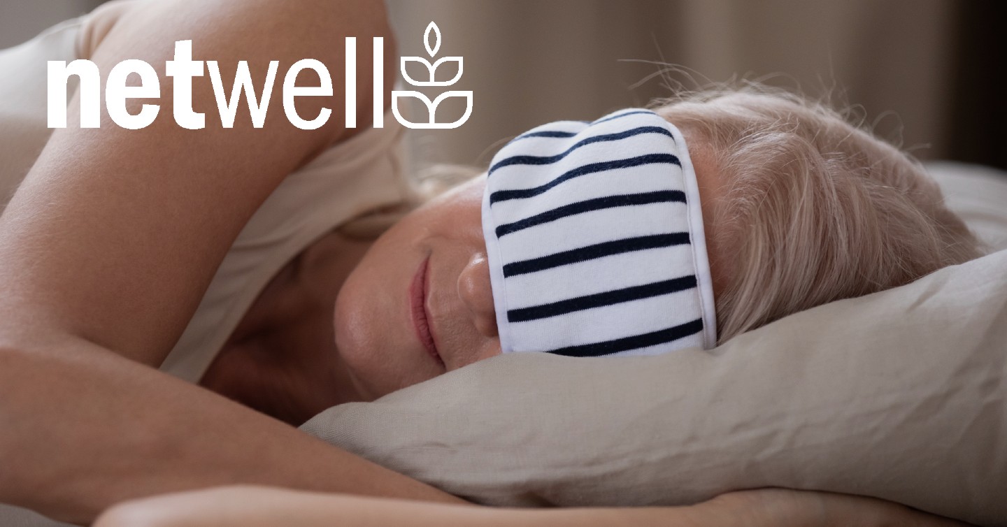 person sleeping on their side with sleep mask