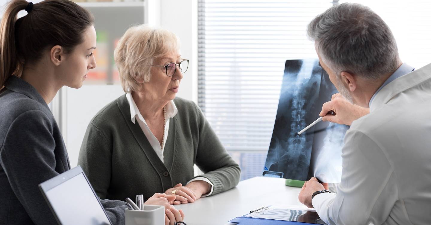 physician going over results of bone density screening
