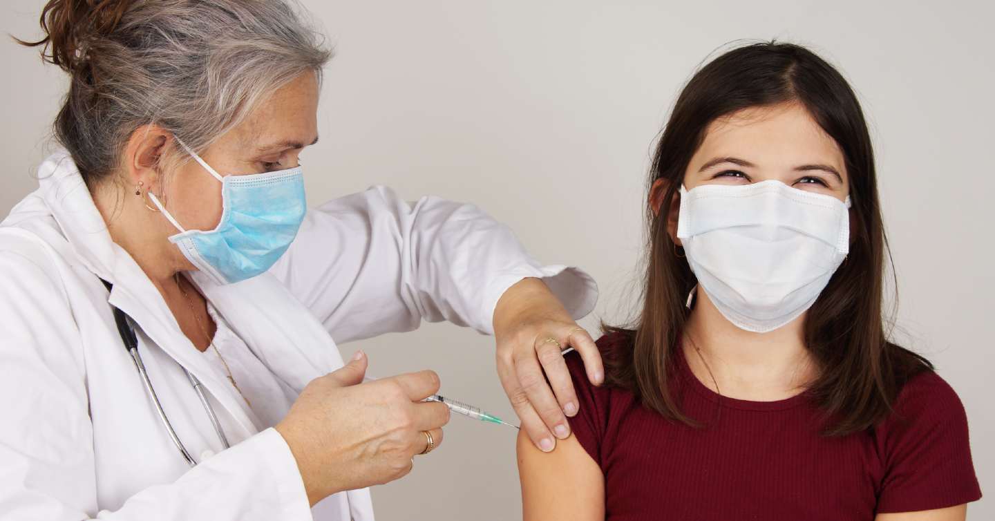 teen receiving a vaccine