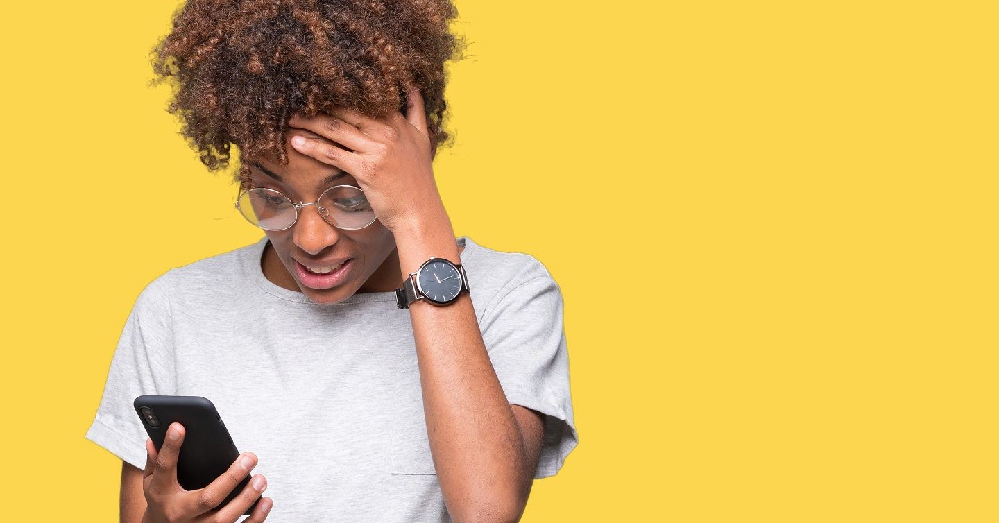 person being stressed looking at their smartphone and smartwatch